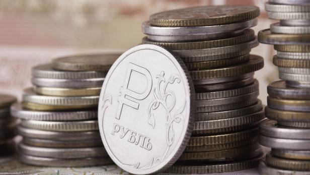 coin ruble on the background of banknotes and money stacks