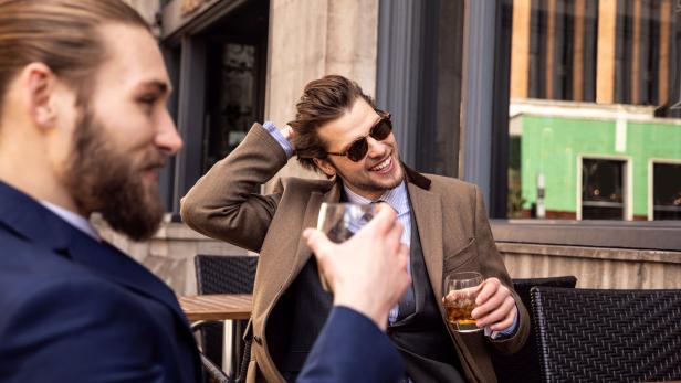 Business break - Two young businessmen taking a break in Central London